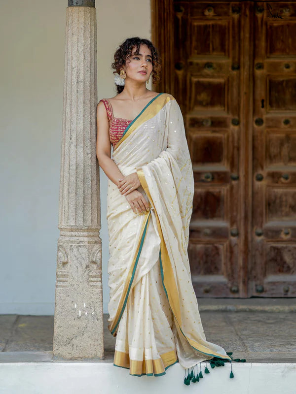 Lightweight Off-White Mul Cotton Saree With Gold Zari And Contrasting Green Tassels
