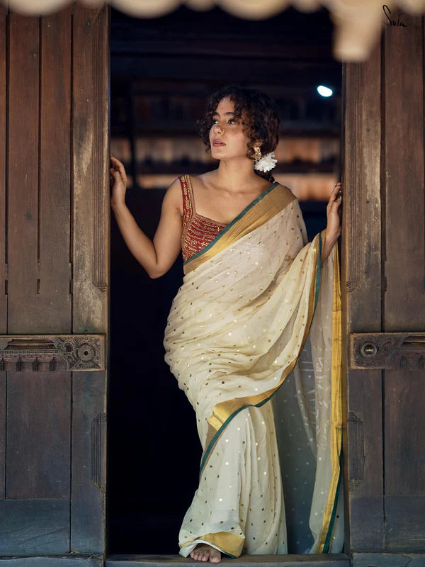 Lightweight Off-White Mul Cotton Saree With Gold Zari And Contrasting Green Tassels