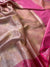 Pink and gold patterned fabric with a textured surface