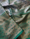 Close-up of patterned fabric with green and brown colors