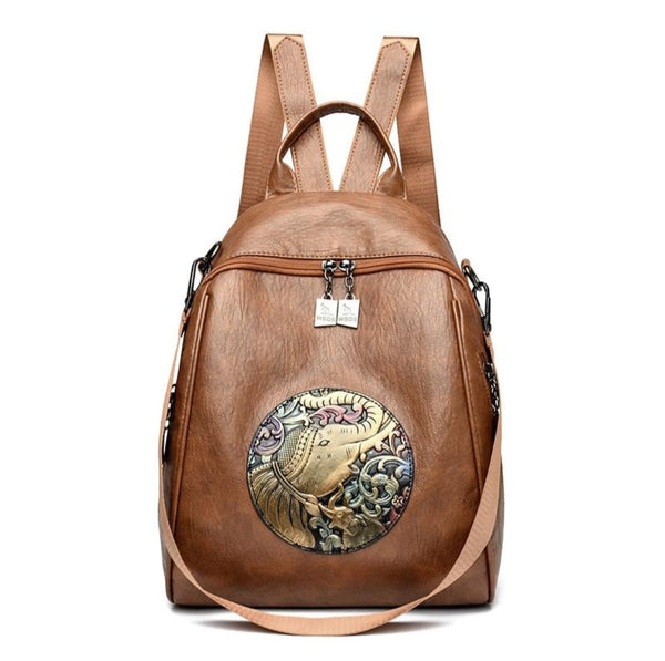 Brown backpack with decorative emblem on a white background