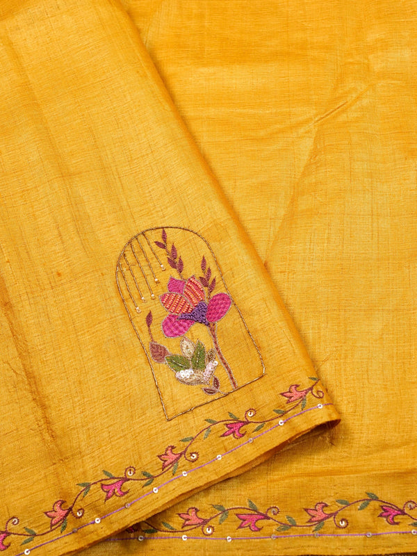 Yellow fabric with floral embroidery