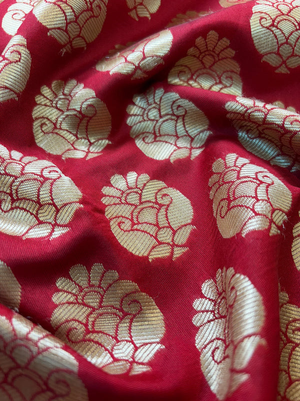 Red fabric with gold floral patterns