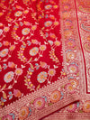 Red fabric with intricate floral patterns and embroidery