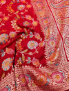 Red fabric with intricate floral embroidery and patterns
