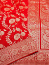 Red fabric with white floral and paisley patterns