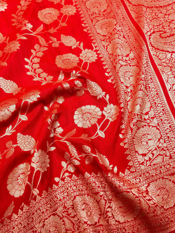 Red fabric with white floral and paisley patterns