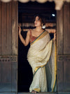Lightweight Off-White Mul Cotton Saree With Gold Zari And Contrasting Green Tassels