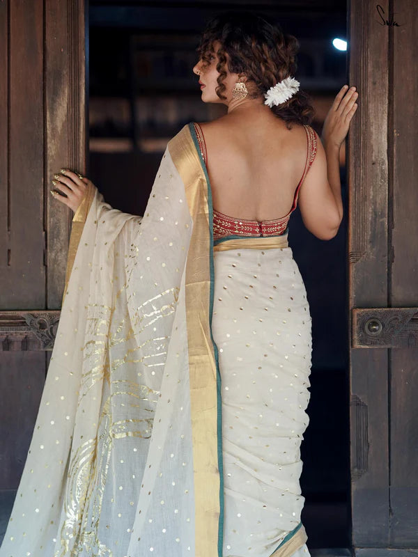 Lightweight Off-White Mul Cotton Saree With Gold Zari And Contrasting Green Tassels