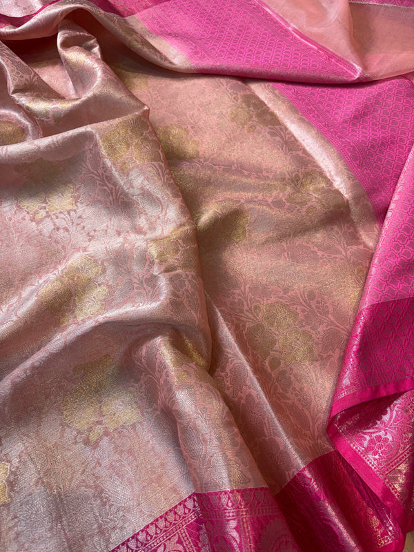 Pink and gold patterned fabric with a textured surface