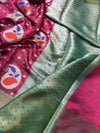Close-up of a pink fabric with floral patterns and green patterned fabric.