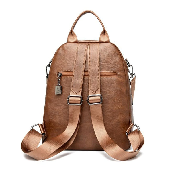 Brown leather backpack on a white background