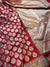 Red and gold patterned fabric with intricate designs