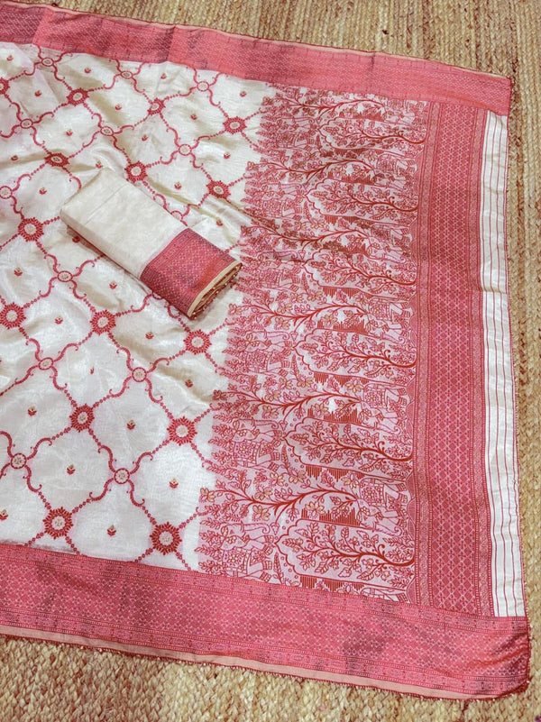 White fabric with red patterns on a textured surface