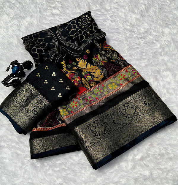 Black saree with colorful patterns on a textured white background