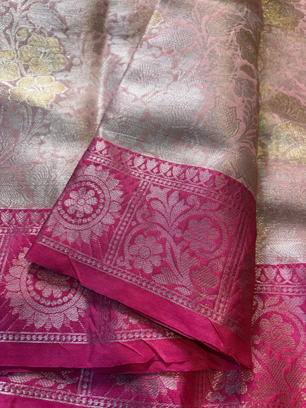 Pink and silver saree with intricate patterns