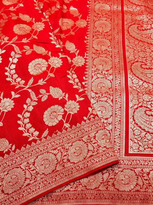 Red fabric with white floral and paisley patterns