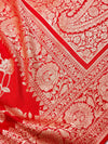 Red fabric with intricate gold patterns