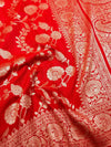 Red fabric with white floral and paisley patterns
